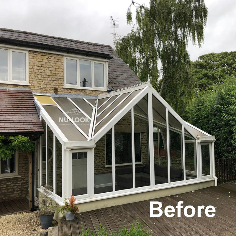 Nu-Look before image of a conservatory with a glass roof with a grey film over it.