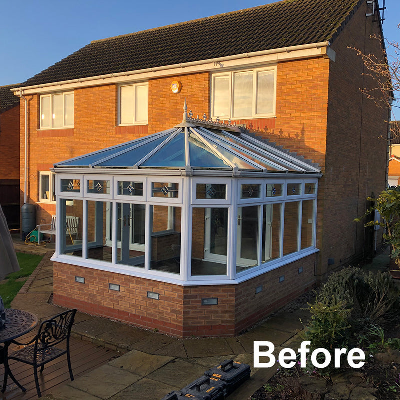 Nu-Look before image of a conservatory with a Victorian glass roof.